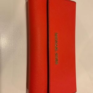 Bright red Michael Kors wallet. Like new.